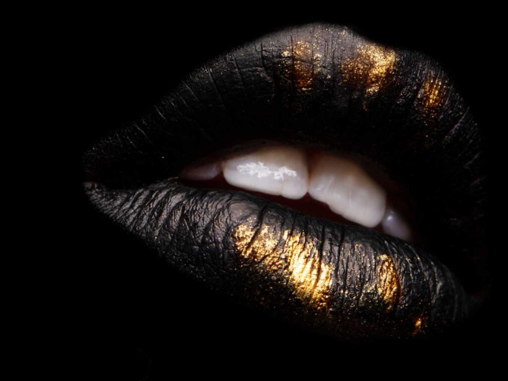 Lips with black and gold lip color