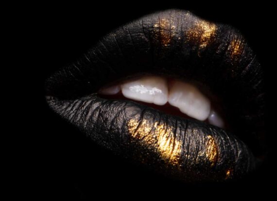 Lips with black and gold lip color