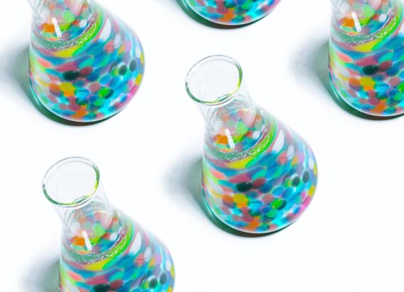 Beakers filled with bubbles of varying colors
