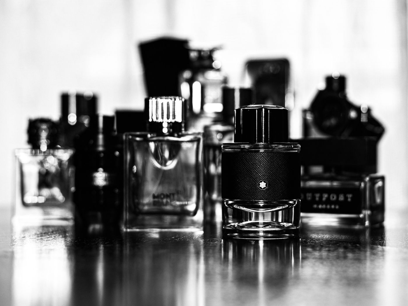 Black and white photo of perfume bottles