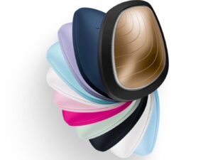 An array of multi-coloured electronic face mask and massaging devices.