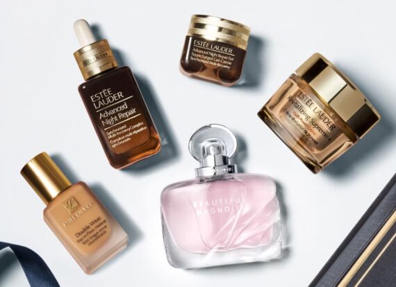 A selection of Estée Lauder skin care, makeup and fragrance products against a white backdrop