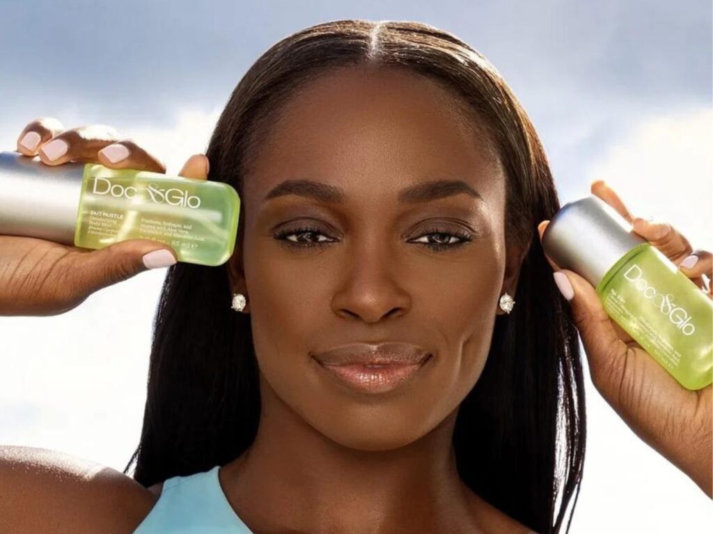 Sloane Stephens holds two Doc+Glo products in green bottles.
