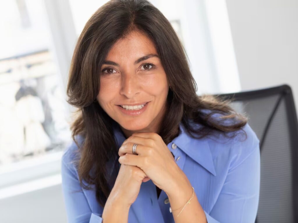 Simona Cattaneo smiling, wearing a blue shirt