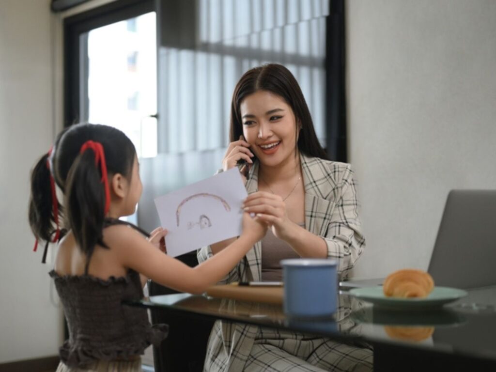 Photo of working Mother and daughter
