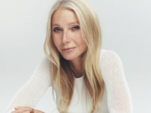 Gwyneth Paltrow, wearing a fine, white long sleeved sweater