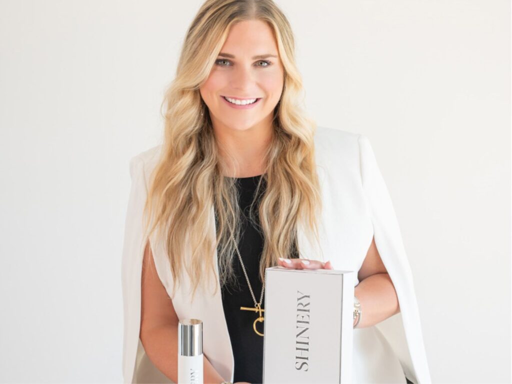 Photo of Shinery CEO, Brea Fullerton, with the brand's products