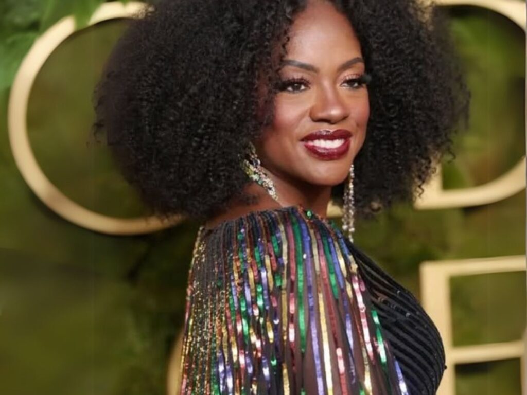 Viola Davies wears a shimmering multi-coloured dress and dark cherry lipstick at the Golden Globes