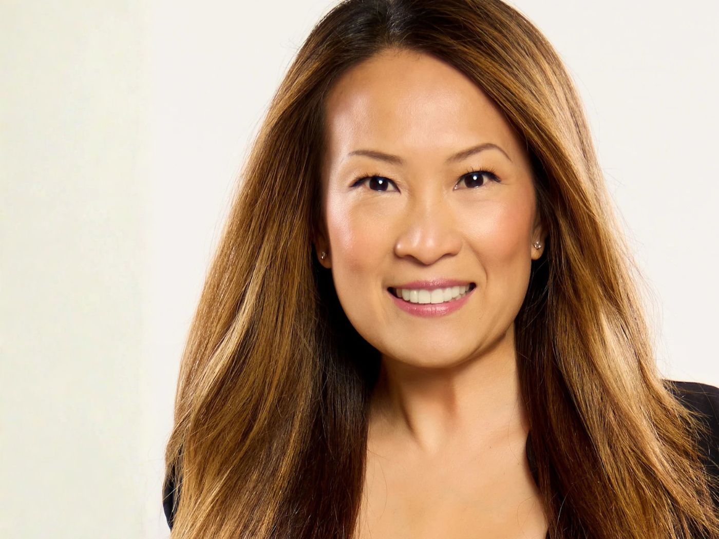 Maly Bernstein wearing a black blazer, smiling