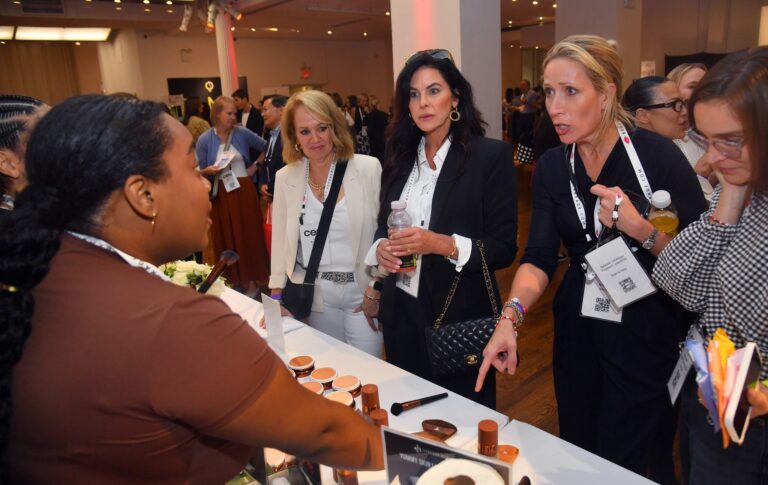 Brand representatives and guests on the Beauty Expo show floor
