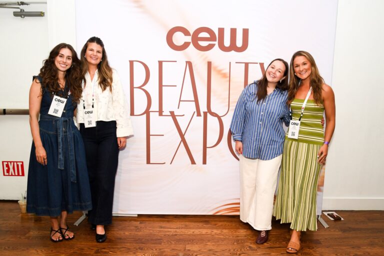 Guests at the CEW Beauty Expo step and repeat