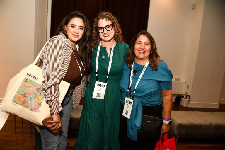 Guests carrying CEW Beauty Expo totes