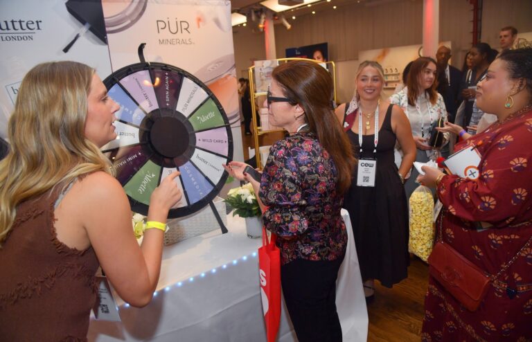Guests at a sponsor activation with a prize wheel